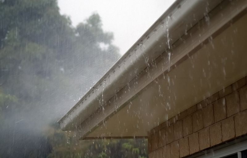 Rainwater draining smoothly through a seamless gutter