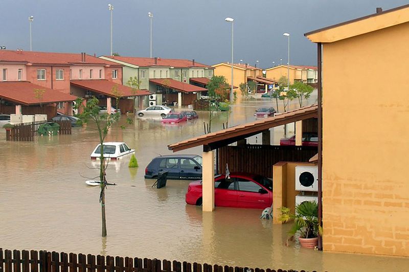 A flooded residential street after heavy rain